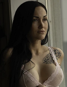 Modesty headshot, petite tattooed brunette